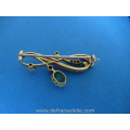 een 14 karaat gouden art nouveau diamant smaragd broche