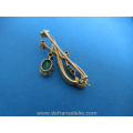 een 14 karaat gouden art nouveau diamant smaragd broche